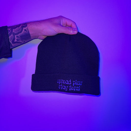 Spread Plur Stay Feral Beanie studio shot