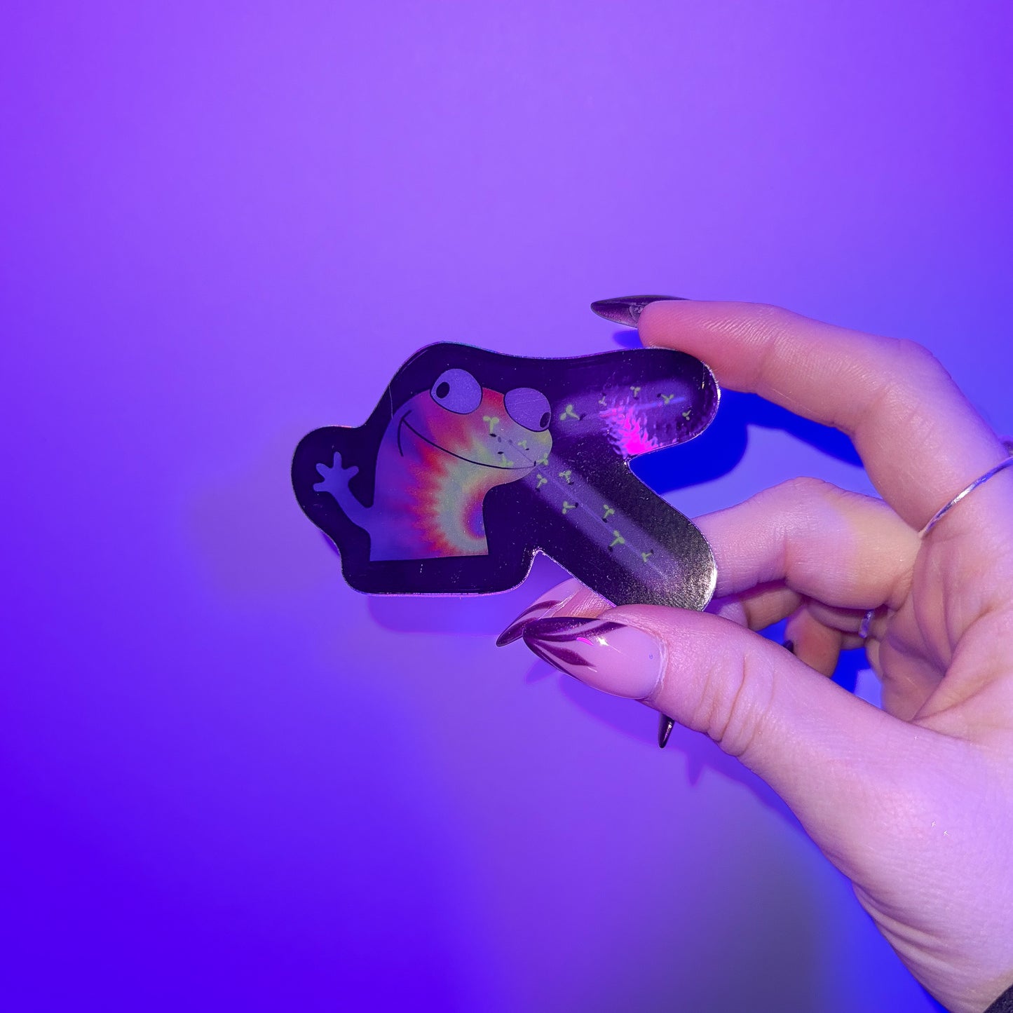 Lizard Meme Holographic Sticker studio shot in hand