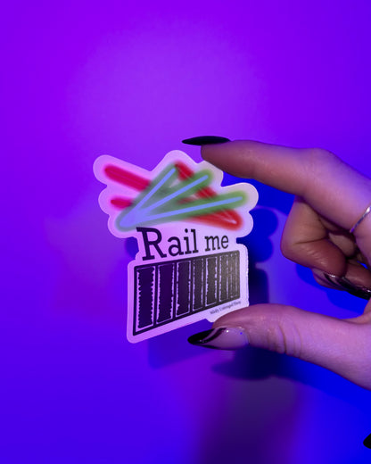 Rail Me Pun Rave Sticker studio shot in hand